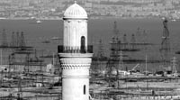 Bibi Heybat Mosque and oil derricks on the shores of the Caspian Sea in Baku.